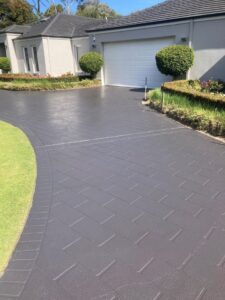 painted driveway with house - residential painting